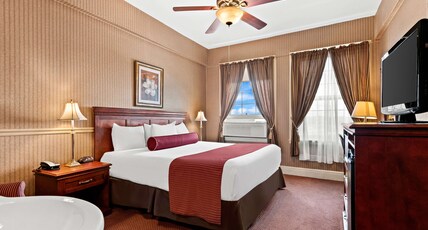 Genetti Hotel, SureStay Collection by Best Western Room Type - Suite-1 King Bed, Non-Smoking, Living Room With Sofabed, Microwave And Refrigerator, Flat Screen Tel Genetti Hotel, SureStay Collection by Best Western Room Type - Suite-1 King Bed, Non-Smoking, Living Room With Sofabed, Microwave And Refrigerator, Flat Screen Tel