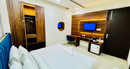Palette Hotel & Convention Centre by CheckIn, Millennium City Gurugram Room Type - Deluxe King Room with Balcony