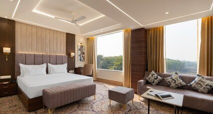 Clarks Inn Suites, Agra Room Type - Suite Room with Living area and King Bed