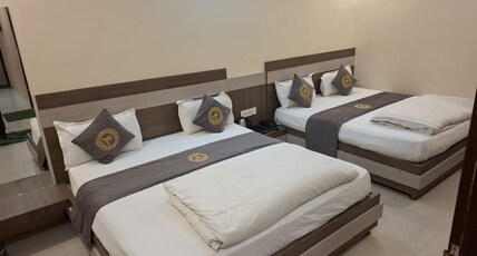 HOTEL PUJARI Room Type - LUXURY TRIPLE ROOM